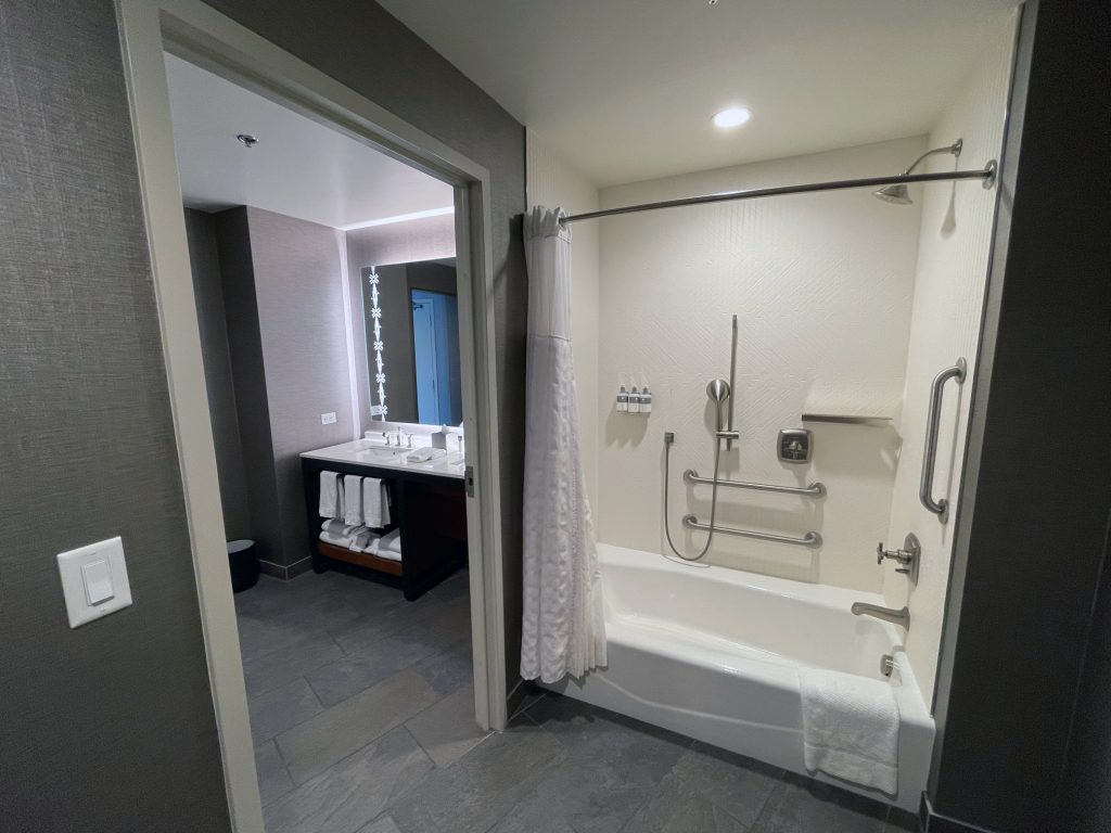 Second part of bathroom with shower and tub