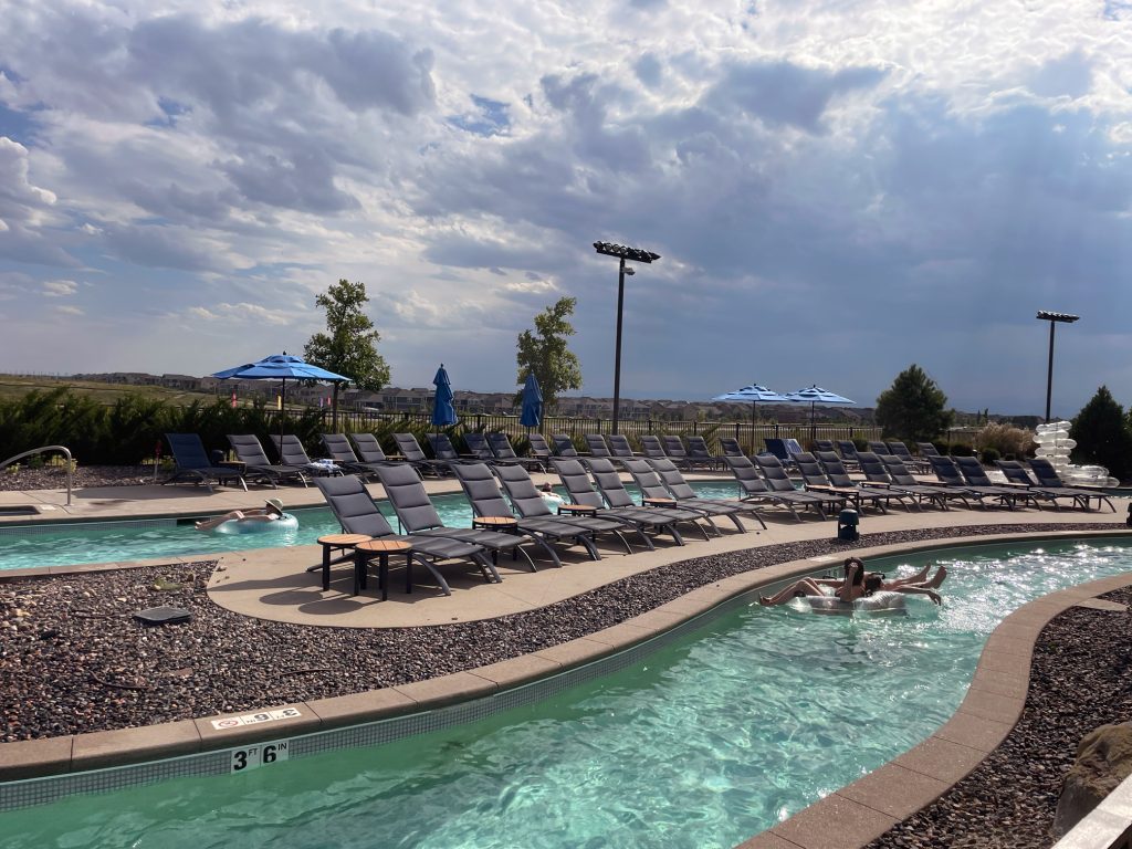 Lazy river and lawn chairs at Gaylord Rockies water park
